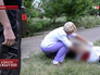 Врач осматривает погибшего при обстреле Донецка Врач осматривает погибшего при обстреле Донецка