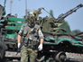 Народный ополченец около брошенной военной техники украинской армии Народный ополченец около брошенной военной техники украинской армии