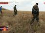 Саперы ищут не разорвавшиеся снаряды в Донецкой области Саперы ищут не разорвавшиеся снаряды в Донецкой области
