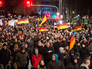 Участник митинга в Германии Участник митинга в Германии