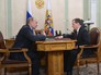 Президент России Владимир Путин и председатель правительства России Дмитрий Медведев во время встречи Президент России Владимир Путин и председатель правительства России Дмитрий Медведев во время встречи