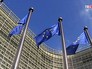 Флаги Евросоюза у здания штаб-квартиры ЕС Флаги Евросоюза у здания штаб-квартиры ЕС