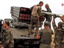 Украинские военные заряжают РСЗО "Град" Украинские военные заряжают РСЗО "Град"