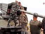 Украинские военные заряжают РСЗО "Град" Украинские военные заряжают РСЗО "Град"