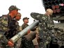 Украинские военные заряжают РСЗО "Град" Украинские военные заряжают РСЗО "Град"