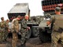 Украинские военные заряжают РСЗО "Град" Украинские военные заряжают РСЗО "Град"