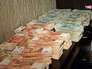Изъятые деньги при обыске в доме руководителя секты "бога Кузи" Изъятые деньги при обыске в доме руководителя секты "бога Кузи"