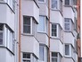 Окна многоэтажного жилого дома Окна многоэтажного жилого дома