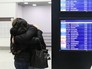 Люди у табло прилета в аэропорту "Пулково" Люди у табло прилета в аэропорту "Пулково"