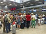 Туристы в аэропорту Туристы в аэропорту