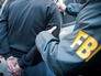 Сотрудники ФБР проводят задержание Сотрудники ФБР проводят задержание