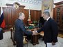 Президент России Владимир Путин и министр обороны России Сергей Шойгу во время встречи Президент России Владимир Путин и министр обороны России Сергей Шойгу во время встречи