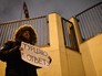 Молодой человек с плакатом во время акции протеста у посольства Турции в Москве Молодой человек с плакатом во время акции протеста у посольства Турции в Москве