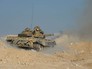 Танк Т-72 сирийской армии ведет огонь на передовой позиции Танк Т-72 сирийской армии ведет огонь на передовой позиции
