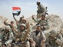 Бойцы отряда народного ополчения с флагом Сирии Бойцы отряда народного ополчения с флагом Сирии