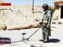 Сапер во время разминирования дороги в Пальмире Сапер во время разминирования дороги в Пальмире