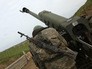 Военнослужащий на артиллерийской позиции в зоне карабахского конфликта Военнослужащий на артиллерийской позиции в зоне карабахского конфликта