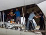 Разгрузка самолета с гуманитарной помощью Разгрузка самолета с гуманитарной помощью