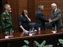 Гражданин Франции Жан-Клод Магэ (справа) во время передачи родителям погибшего в Сирии героя России А.Прохоренко Наталье и Александру Прохоренко своих семейных военных наград Гражданин Франции Жан-Клод Магэ (справа) во время передачи родителям погибшего в Сирии героя России А.Прохоренко Наталье и Александру Прохоренко своих семейных военных наград