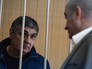 Обвиняемый в организации преступного сообщества Захарий Калашов (слева), известный в криминальных кругах как "вор в законе" Шакро Молодой Обвиняемый в организации преступного сообщества Захарий Калашов (слева), известный в криминальных кругах как "вор в законе" Шакро Молодой