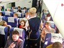 Пассажиры в самолете Пассажиры в самолете