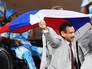 Андрей Фомочкин с флагом России во время парада атлетов и членов национальных делегаций на церемонии открытия XV летних Паралимпийских игр 2016 в Рио-де-Жанейро Андрей Фомочкин с флагом России во время парада атлетов и членов национальных делегаций на церемонии открытия XV летних Паралимпийских игр 2016 в Рио-де-Жанейро