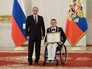 Президент России Владимир Путин во время встречи в Кремле с паралимпийской сборной России по летним видам спорта Президент России Владимир Путин во время встречи в Кремле с паралимпийской сборной России по летним видам спорта