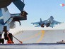 Истребитель Су-33 на палубе авианосца "Адмирал Флота Советского Союза Кузнецов" Истребитель Су-33 на палубе авианосца "Адмирал Флота Советского Союза Кузнецов"