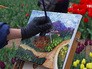 Художник рисует тюльпаны Художник рисует тюльпаны