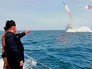 Глава КНДР Ким Чен Ын наблюдает за запуском ракеты Глава КНДР Ким Чен Ын наблюдает за запуском ракеты