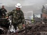 Сотрудник спасательной службы на месте взрыва в Колумбии Сотрудник спасательной службы на месте взрыва в Колумбии