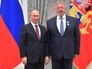 Владимир Путин награждает президент Общероссийской общественной организации "Федерация спортивной гимнастики Росси" Василия Титова Владимир Путин награждает президент Общероссийской общественной организации "Федерация спортивной гимнастики Росси" Василия Титова