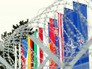 Флаги стран НАТО за колючей проволокой Флаги стран НАТО за колючей проволокой