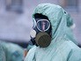 Военнослужащий в костюме химзащиты Военнослужащий в костюме химзащиты