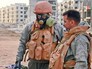 Российские военные в костюмах химзащиты в Сирии Российские военные в костюмах химзащиты в Сирии