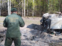 Сотрудник СКР на месте подрыва автомобиля Захара Прилепин