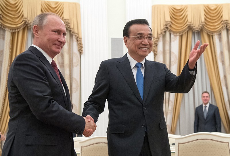 Президент РФ Владимир Путин и премьер КНР Ли Кэцян